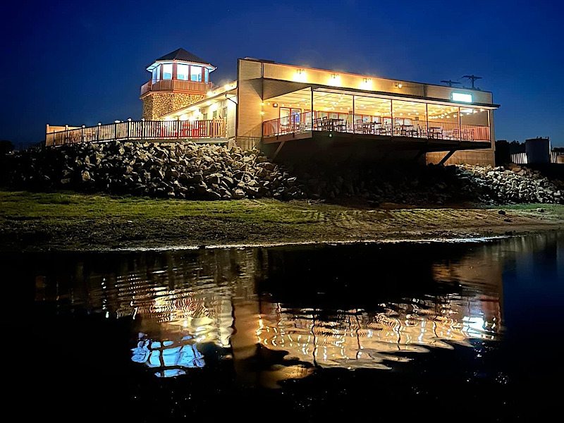 Marina at night with reflection on lake